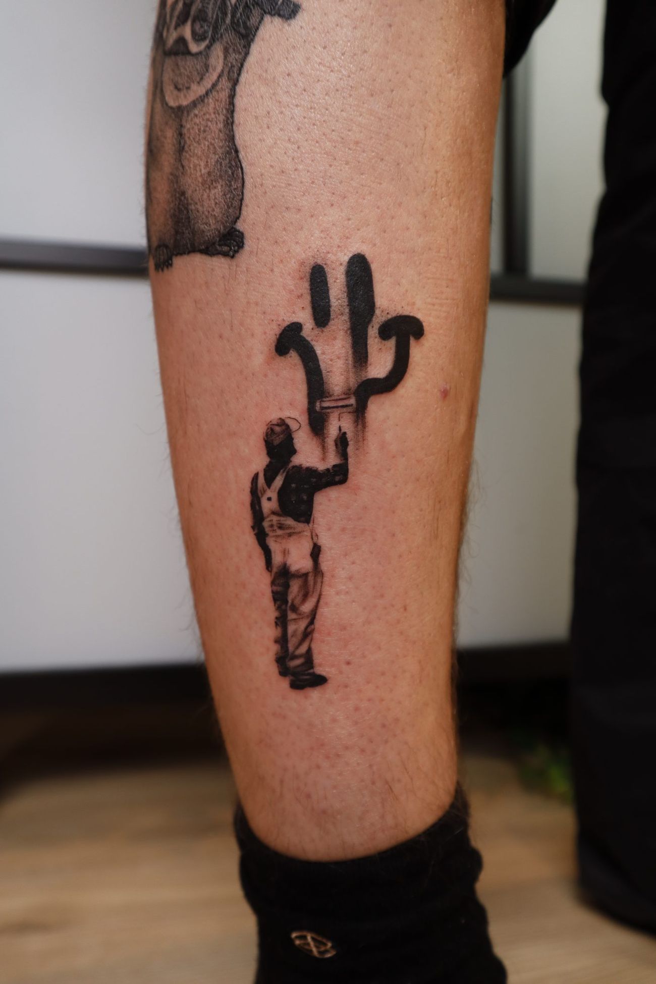 a tattoo on a person's leg
